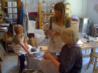 Judy demonstrating how to trim a bottle Judy, Sophia, and Gabriel in the studio